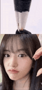 a close up of a woman 's face and a close up of a brush .
