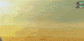 a robot with a gun is standing in the desert .