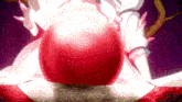 a woman in a white dress holds a large red ball