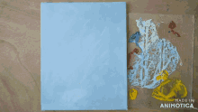 a person is painting on a piece of paper that says made in animatica on it