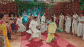 a man and woman are dancing in front of a crowd