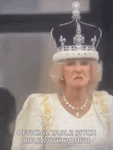 a woman wearing a crown and a necklace says " official table bitch rule with honor " .
