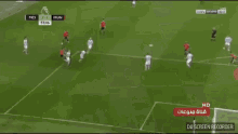 a soccer game is being played on a green field and the score is 2-1