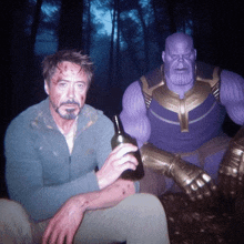 a man sitting next to a purple thanos figure