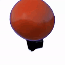 a bunch of red balls are stacked together on a white background