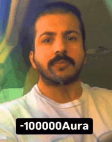 a man with a beard and mustache is wearing a white t-shirt that says -110000 aura