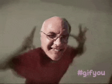 a man with glasses is making a funny face with his arms outstretched .
