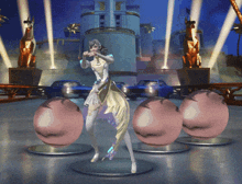 a statue of a woman in a white and gold dress is standing in front of a building