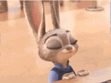 a close up of a cartoon rabbit 's ears with its eyes closed