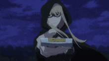 a woman in a hooded cape is holding a glowing object