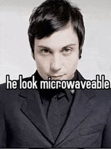 a man in a suit with the words he look microwaveable above him