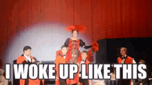 a group of people standing on a stage with the words i woke up like this written on it
