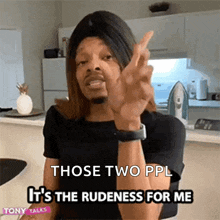a man in a wig is giving the middle finger and says " those two ppl it 's the rudedness for me "