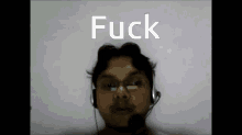 a man wearing headphones with the word fuck written above him