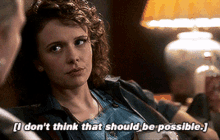 a woman says " i don 't think that should be possible " while sitting in front of a lamp