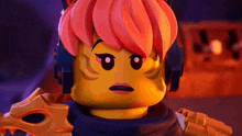 a close up of a lego figure with red hair