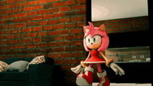 amy rose from sonic the hedgehog standing in a living room