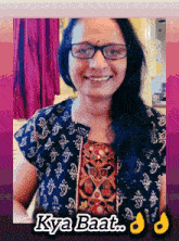 a woman wearing glasses is smiling with the words kya baat written below her