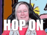 a woman wearing headphones has the word hop on written on her face