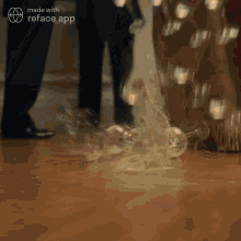 a light bulb is being thrown on the floor by a person