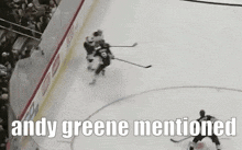 a hockey game with the words andy greene mentioned above it