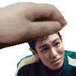 a hand is holding a man 's head in a pixel art style .