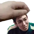 a hand is holding a man 's head in a pixel art style .