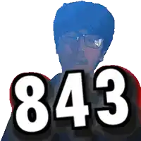a man with glasses and the number 843 in front of his face