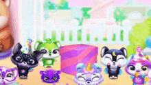 a group of animals are standing next to each other on a table in a room .