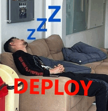 a man is sleeping on a couch with the word deploy written on it