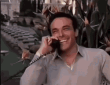 Scarface Phone Laughing GIF