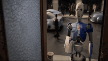 a fedex robot is standing in front of a building