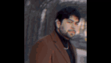 a close up of a man 's face with a blurred background