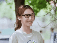a woman wearing glasses and a shirt that says " it good times "