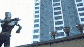 a statue of a man is standing in front of a tall building with a sign on it that says ' a '