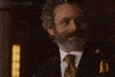 a man with curly hair and a beard says but i won t dance sexy