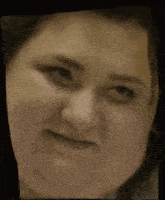 a close up of a woman making a funny face