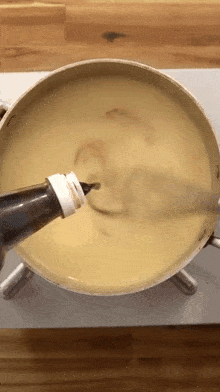 stirring albert cancook mixing preparing ingredients adding some sauce