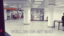 a man is standing in a store with the words well im on my way written on the floor