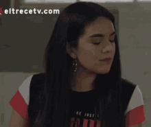 a woman is wearing a shirt that says " are just "