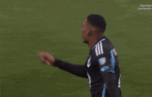 two soccer players one with the number 21 on his jersey