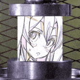 a drawing of a girl 's face is being pressed into a metal cylinder