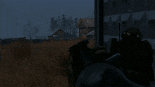 a person is holding a gun in front of a wall