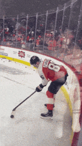 a hockey player with the number 8 on the back of his shirt