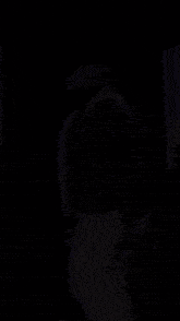 a man with a beard is holding a microphone in his hand
