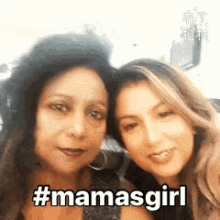 two women are posing for a picture and one of them is using the hashtag #mamasgirl