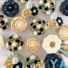 a bunch of cupcakes with flowers on them and the letter y on the bottom left