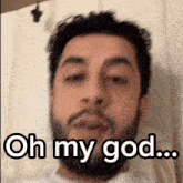 a man with a beard says " oh my god " in front of his face