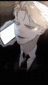 a man in a suit and tie is talking on a cellphone