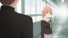 a girl with red hair is standing next to a boy